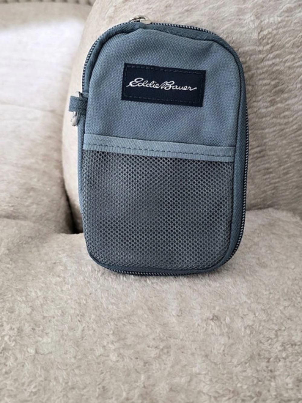 Eddie Bauer nylon utility pouch with a front mesh pocket and a zipper closure.